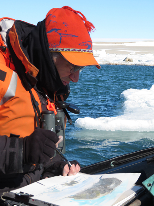 At work in Svalbard sketching a polar bear (resting on the ice edge just over my left shoulder).